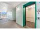 Hallway featuring an elevator with a green frame at 801 83Rd N Ave # 217, St Petersburg, FL 33702