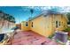 Yellow house with a large backyard deck at 830 S Davis Blvd, Tampa, FL 33606