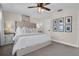 Main bedroom with king-size bed and neutral decor at 8416 121St Pl, Largo, FL 33773