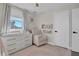 Bedroom with white dresser, armchair, and plenty of natural light at 8416 121St Pl, Largo, FL 33773