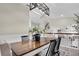 Bright dining room with farmhouse table and chandelier at 8416 121St Pl, Largo, FL 33773