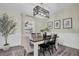 Farmhouse style dining room with wooden table and black chairs at 8416 121St Pl, Largo, FL 33773