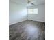 Bedroom with a ceiling fan and new floor with view of the window at 8608 Lake Isle Dr # 0, Temple Terrace, FL 33637