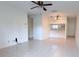 Open-concept living and dining area with tile floors, ceiling fan and lots of natural light at 8608 Lake Isle Dr # 0, Temple Terrace, FL 33637