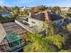 Aerial view of a home with a pool, boat dock, and solar panels located in a waterfront community at 952 Symphony Isles Blvd, Apollo Beach, FL 33572