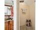 The bathroom features an earthy vanity, stone pebble flooring and a walk-in shower at 952 Symphony Isles Blvd, Apollo Beach, FL 33572