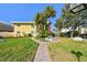 Building exterior with lush landscaping and walkways at 9715 Harrell Ave # 25, Treasure Island, FL 33706