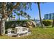 Private patio with table and chairs, overlooking the water at 9715 Harrell Ave # 25, Treasure Island, FL 33706