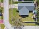 Aerial view of house and lot, showing backyard deck area and mature trees at 9942 56Th Way, Pinellas Park, FL 33782