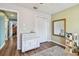 Bright bedroom featuring wood floors, neutral walls, closet, dresser and accent mirror at 9942 56Th Way, Pinellas Park, FL 33782