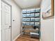 Hallway shelving with ample storage and neutral wall paint at 9942 56Th Way, Pinellas Park, FL 33782