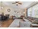 Spacious living room featuring a ceiling fan, dining area and hardwood flooring at 9942 56Th Way, Pinellas Park, FL 33782