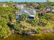 Aerial view of the house showing backyard and canal at 1016 Teal Pointe, Tarpon Springs, FL 34689