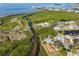 Wide aerial view showcasing the property's waterfront access and surrounding community at 1016 Teal Pointe, Tarpon Springs, FL 34689