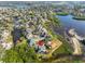 Aerial view of home situated in a quiet waterfront community with mature trees at 1016 Teal Pointe, Tarpon Springs, FL 34689