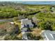 Bird's eye view of waterfront house nestled in lush greenery at 1016 Teal Pointe, Tarpon Springs, FL 34689