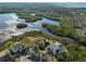 Aerial view shows home's waterfront setting and neighborhood context at 1016 Teal Pointe, Tarpon Springs, FL 34689