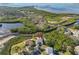 Aerial view showing home's waterfront location and lush landscaping at 1016 Teal Pointe, Tarpon Springs, FL 34689