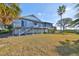 Elevated back deck overlooking a spacious grassy yard at 1016 Teal Pointe, Tarpon Springs, FL 34689