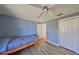 Bedroom with a twin bed and light blue walls at 1016 Teal Pointe, Tarpon Springs, FL 34689