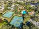 Enjoy resort-style amenities including tennis and pickleball courts and a sparkling pool at 1016 Teal Pointe, Tarpon Springs, FL 34689