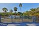 Enjoy waterfront views from this expansive deck with grey railings at 1016 Teal Pointe, Tarpon Springs, FL 34689