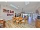 Bright dining room with hardwood floors and large windows at 1016 Teal Pointe, Tarpon Springs, FL 34689