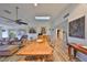 Bright dining room with wood table and chairs, skylights, and kitchen access at 1016 Teal Pointe, Tarpon Springs, FL 34689