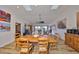 Open concept dining area with wooden table and chairs at 1016 Teal Pointe, Tarpon Springs, FL 34689