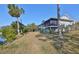 Single story home with screened porch, located on a waterfront property at 1016 Teal Pointe, Tarpon Springs, FL 34689