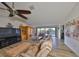 Relaxing living room with leather furniture and large windows at 1016 Teal Pointe, Tarpon Springs, FL 34689