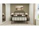 Bedroom with metal bed frame and neutral color scheme at 10199 Gentle Rain Dr, Land O Lakes, FL 34638