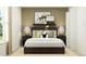 Cozy bedroom with dark brown bed frame and accent pillows at 10199 Gentle Rain Dr, Land O Lakes, FL 34638