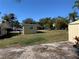 View of backyard with shed and lawn at 11217 Riverview Dr, Riverview, FL 33569