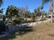 View of a canal with rock seawall and lush vegetation at 11217 Riverview Dr, Riverview, FL 33569