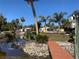 Wooden dock and canal access with tropical plants at 11217 Riverview Dr, Riverview, FL 33569