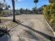 Gravel driveway with curb edging and landscaping at 11217 Riverview Dr, Riverview, FL 33569