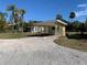 Exterior of a single-story house with a carport at 11217 Riverview Dr, Riverview, FL 33569