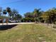 Ample parking area with grassy areas and trees at 11217 Riverview Dr, Riverview, FL 33569