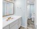 Updated bathroom with a white vanity and light blue walls at 12080 Capri S Cir # 102, Treasure Island, FL 33706