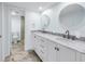 Updated bathroom with double sinks, marble countertops, and separate toilet area at 12080 Capri S Cir # 102, Treasure Island, FL 33706