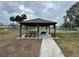 Relaxing gazebo with picnic tables at 12080 Capri S Cir # 102, Treasure Island, FL 33706