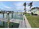 Private dock with water access and lush green surroundings at 12080 Capri S Cir # 102, Treasure Island, FL 33706