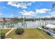 Stunning waterfront view with lush landscaping and boats at 12080 Capri S Cir # 102, Treasure Island, FL 33706