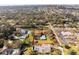 Aerial view of a property showing defined boundaries, a single-Gathering home, and surrounding neighborhood landscape in a scenic area at 13050 110Th Ave, Largo, FL 33774