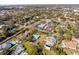 Community aerial shot showing surrounding homes and established, tree-lined neighborhood at 13050 110Th Ave, Largo, FL 33774