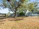 Large backyard featuring chain link fences, lots of foliage, a few trees, and a covered patio at 13050 110Th Ave, Largo, FL 33774