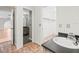 Bathroom featuring a wood vanity cabinet and a view into the walk-in closet and other room at 13050 110Th Ave, Largo, FL 33774