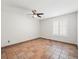 Bedroom featuring tiled flooring, a ceiling fan, and a window with bright shutters at 13050 110Th Ave, Largo, FL 33774