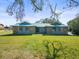 Charming single-story home features a stone facade and a large, well-manicured front lawn at 13050 110Th Ave, Largo, FL 33774